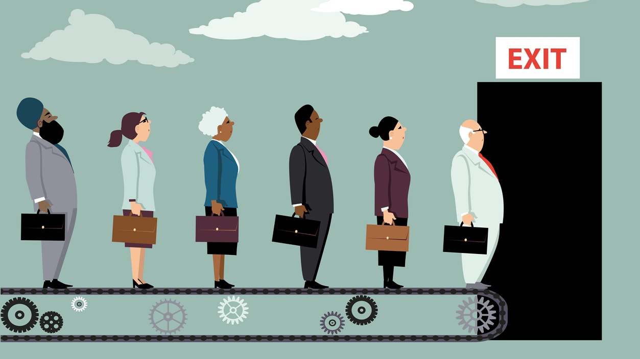 A group of business people standing on a conveyor belt with an exit sign.