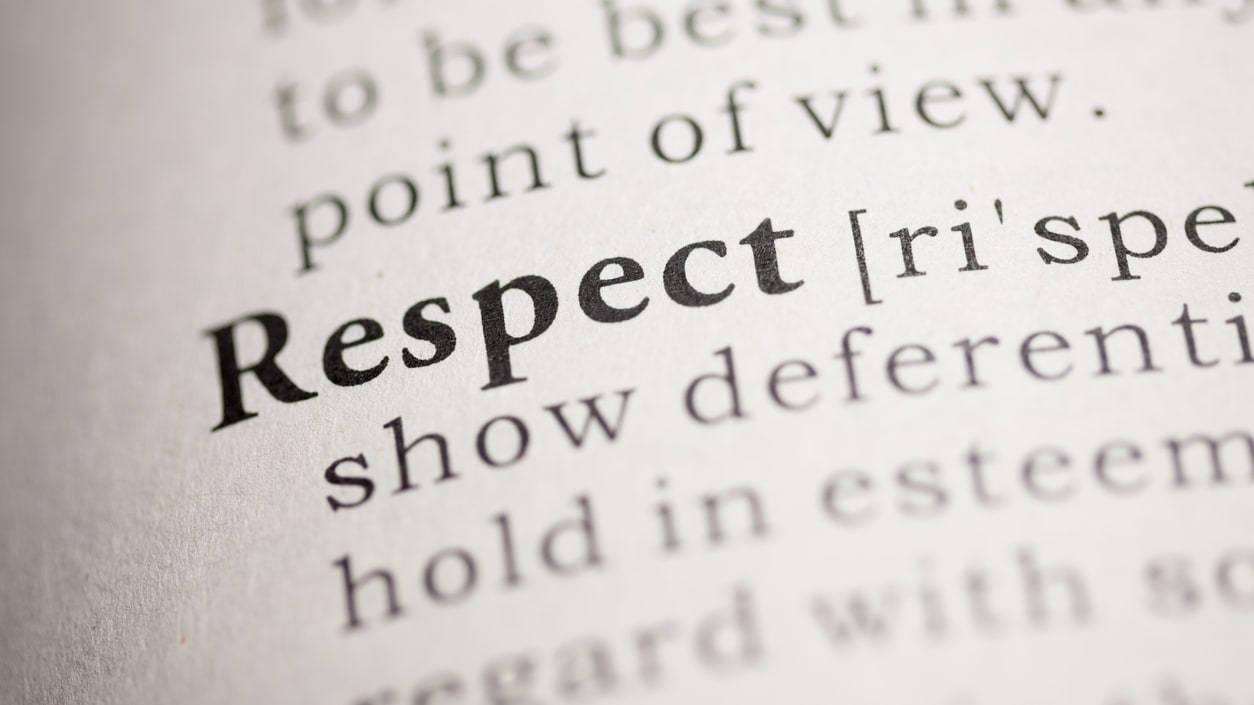 A close up of the word respect in a book.