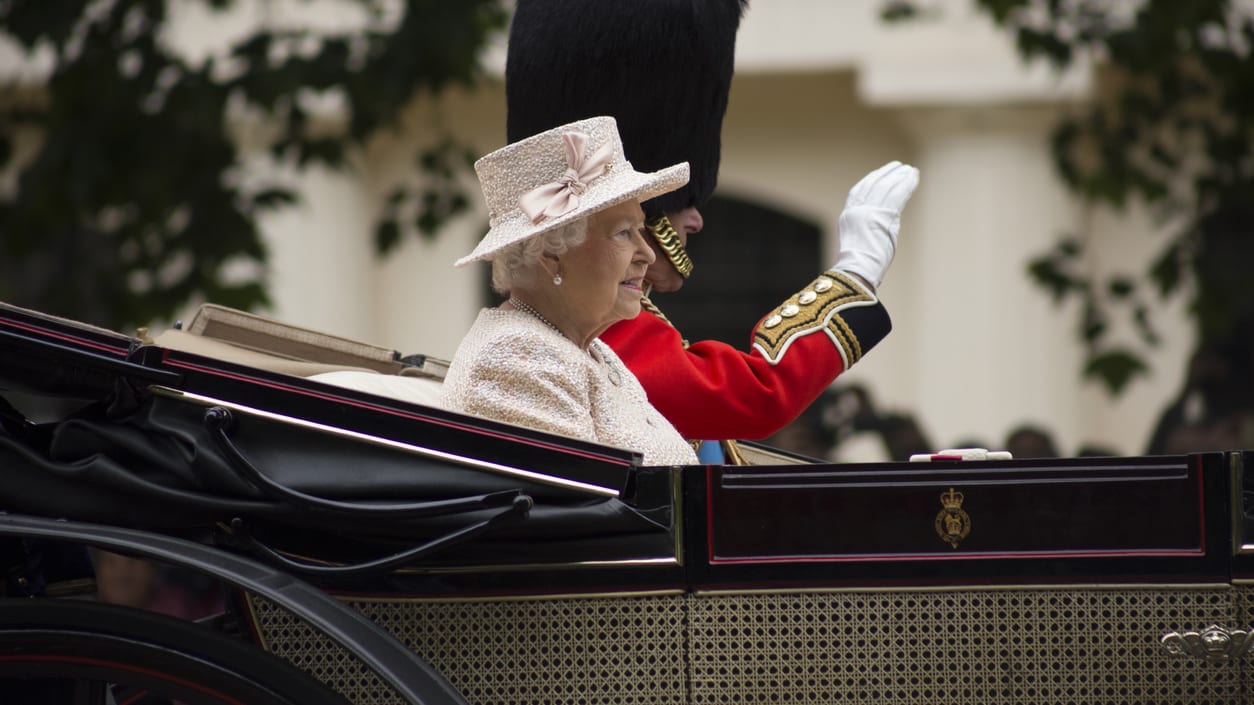 Queen elizabeth i of england riding in a carriage.