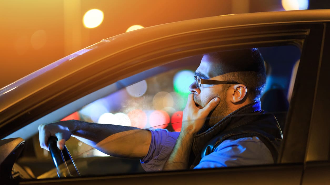 A man driving a car.