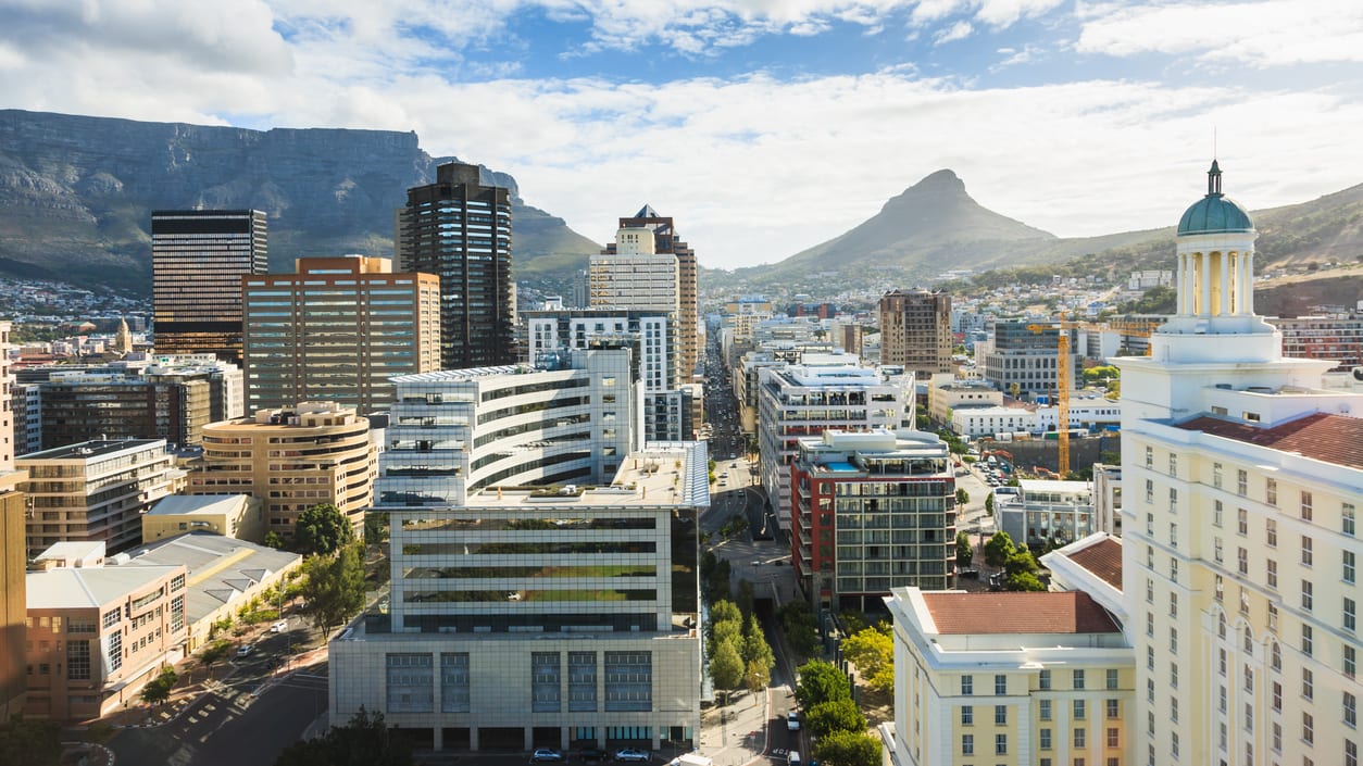 A view of the city of cape town with table mountain in the background.