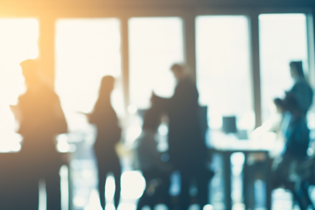 Out-of-focus group of professionals in an office