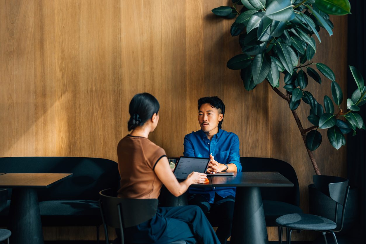 A job interview taking place in a modern meeting room. 