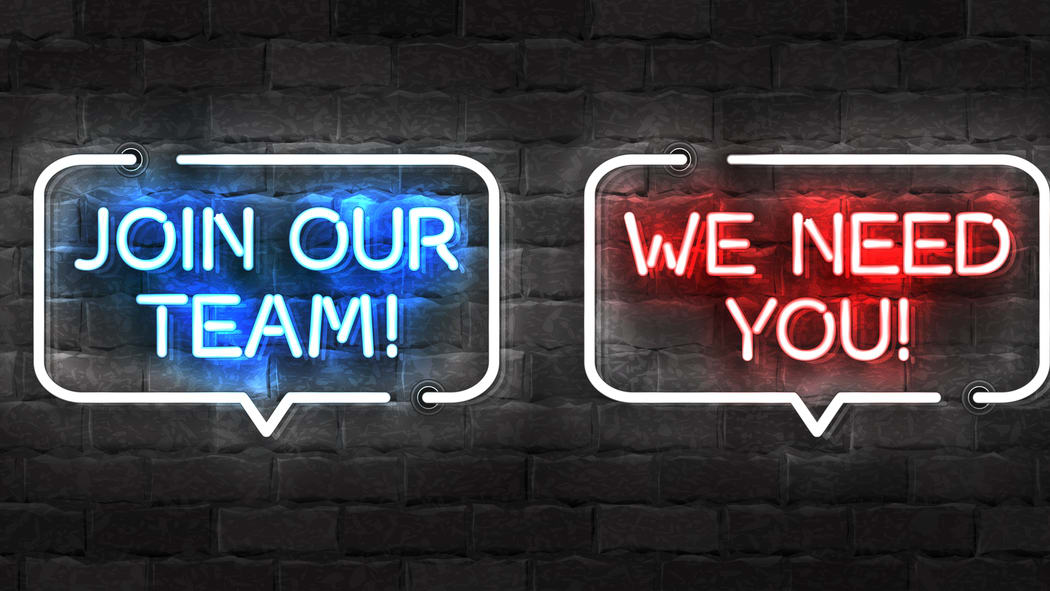 Three neon signs that say we need hiring team you.