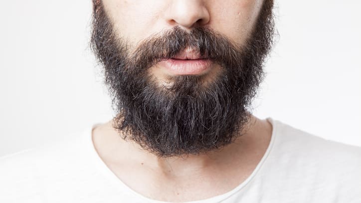 A man with a beard looking at the camera.