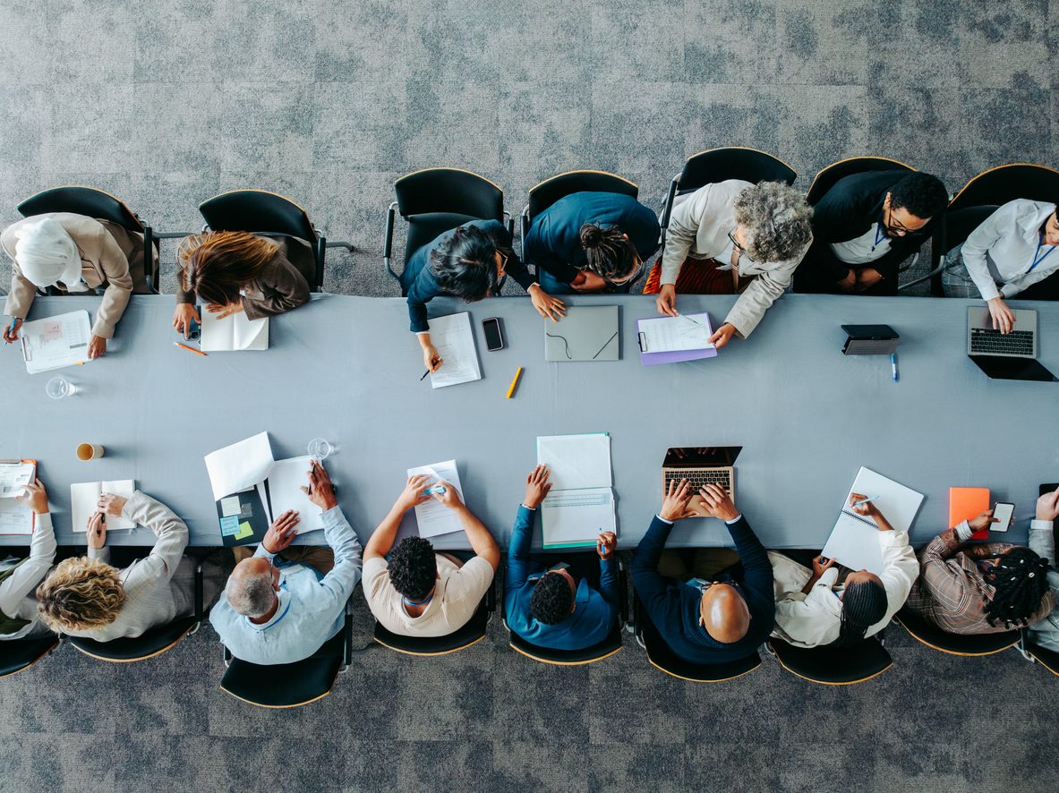 A large number of employees convene for a business meeting.