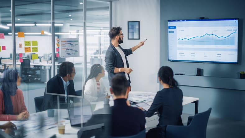 A group of business people in a meeting room.