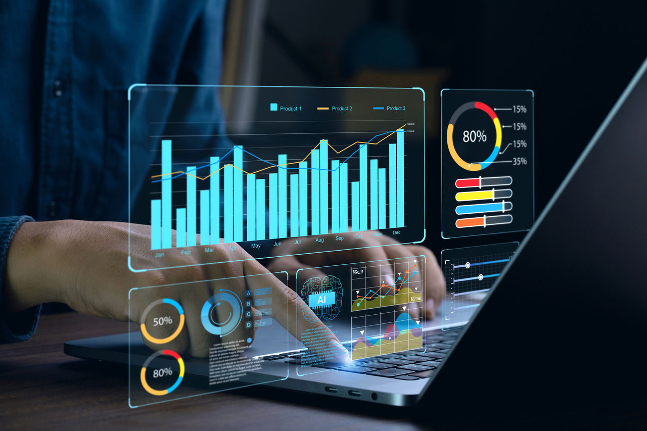 Laptop shows business analytics dashboard with charts, metrics, and KPI to analyze performance and provide insights 