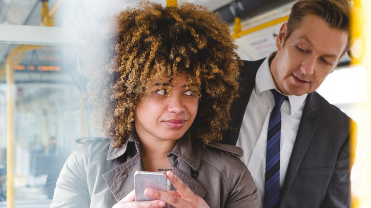 A woman looking at a phone.