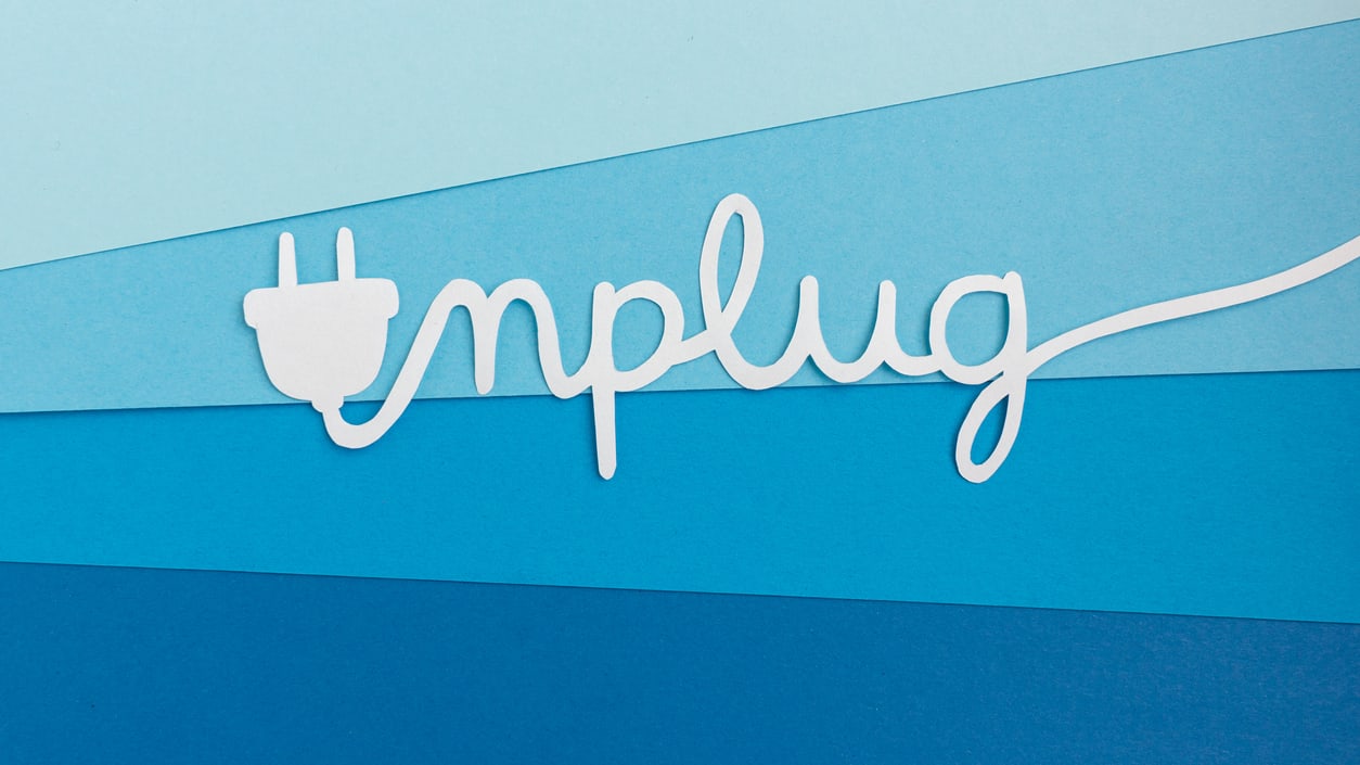 A graphic with the word unplug spelled out with an electrical cord.