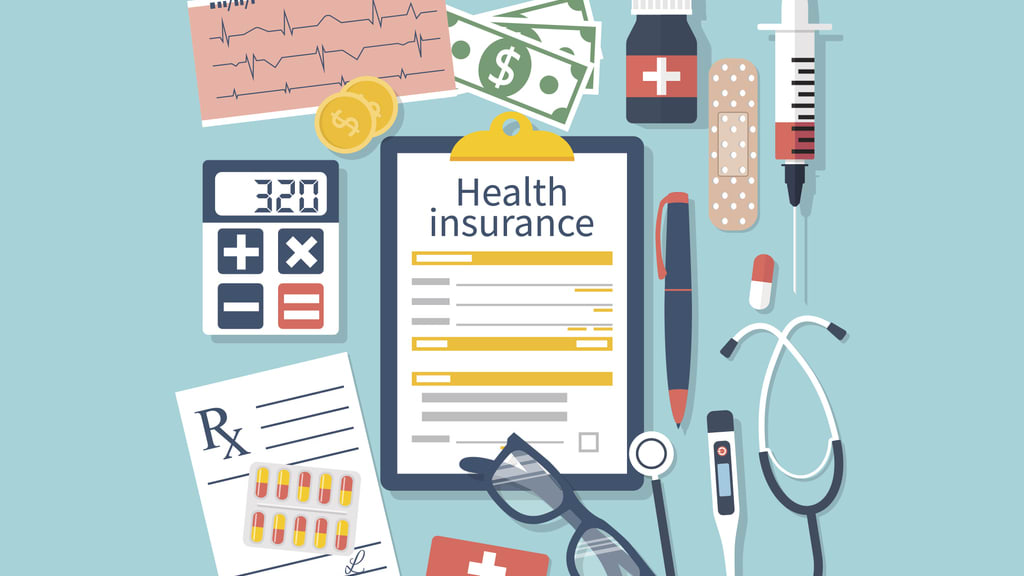 Health insurance concept with a clipboard, stethoscope and other medical items.