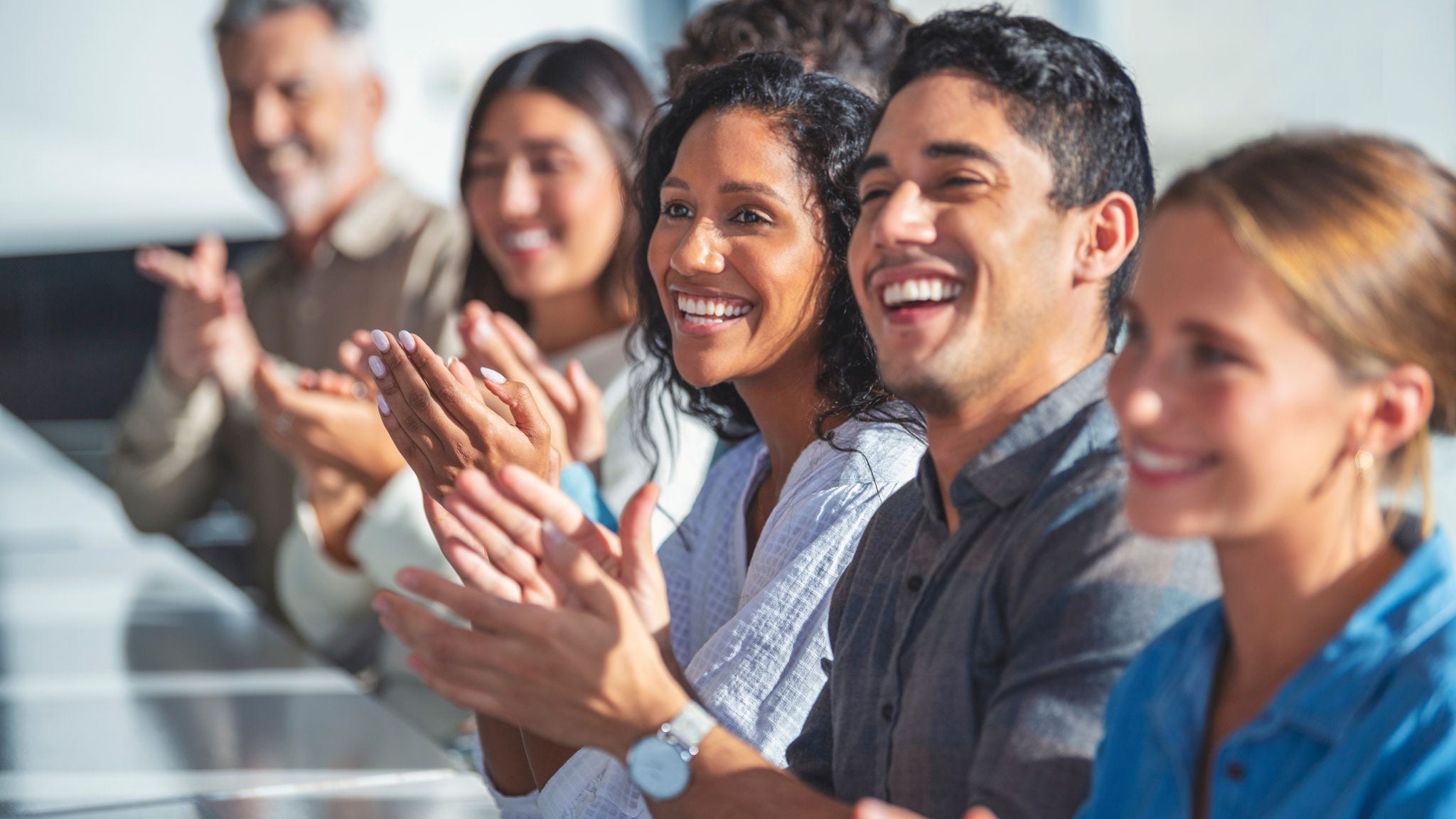 group of people clapping