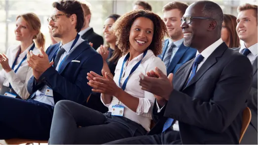 people clapping at a conference