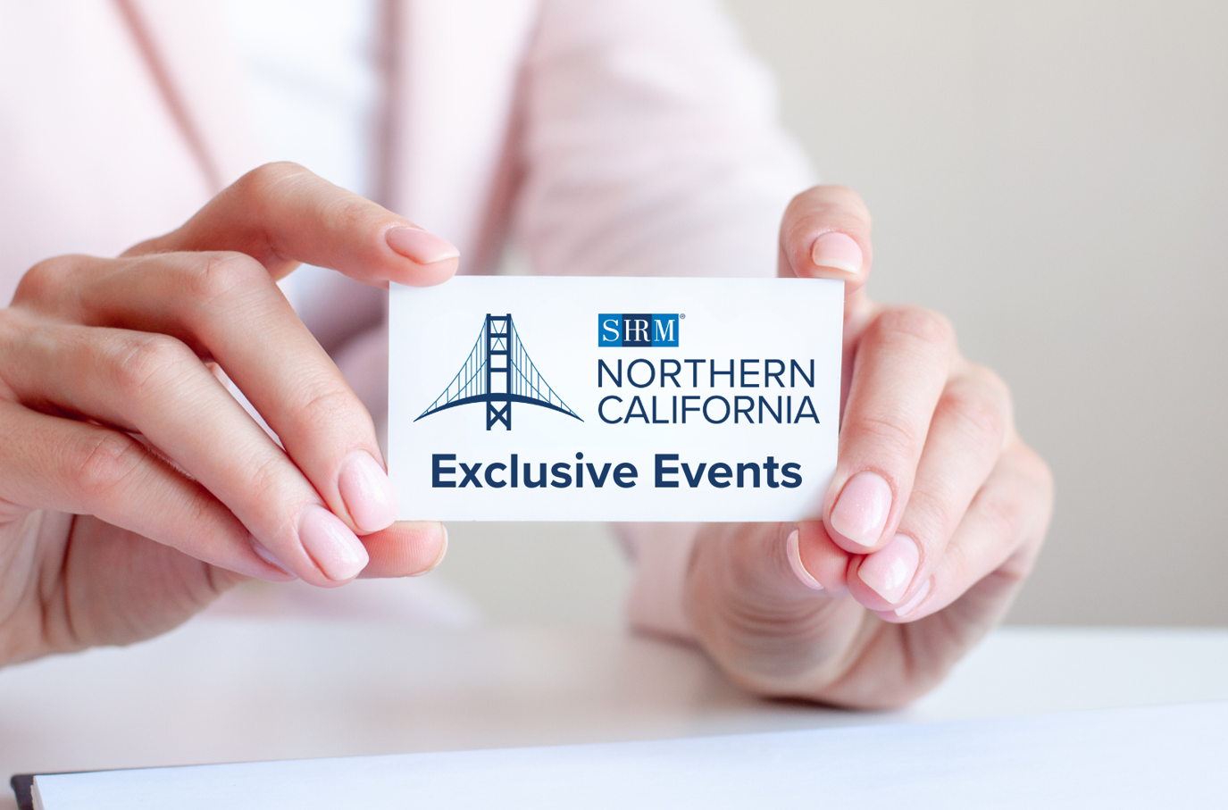women's hands holding a business card Exclusive Events