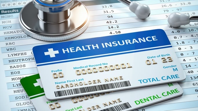 Health insurance cards with a stethoscope and a stethoscope.