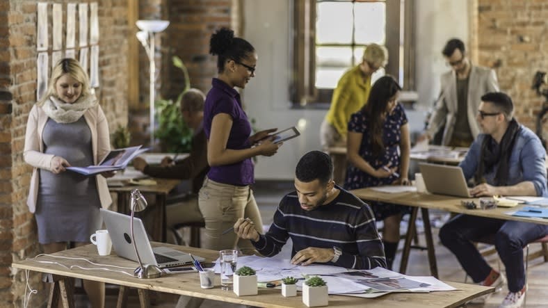 A group of people working in an office.