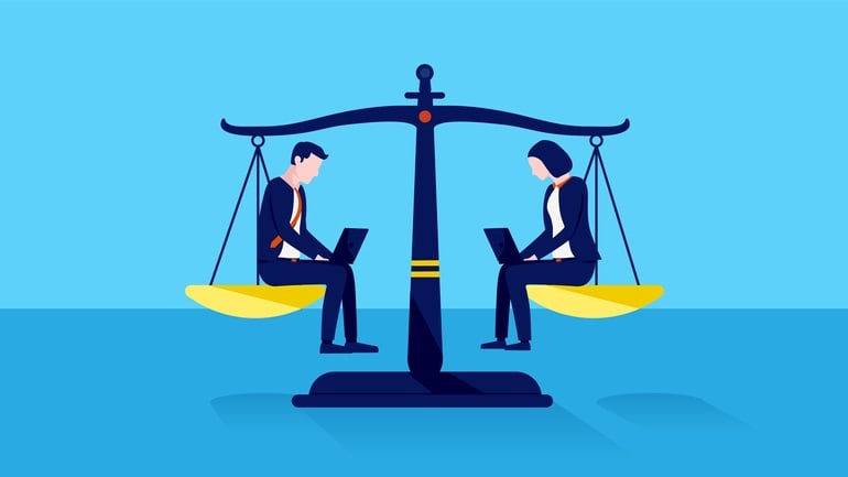 Two business people sitting on a balance scale with laptops.