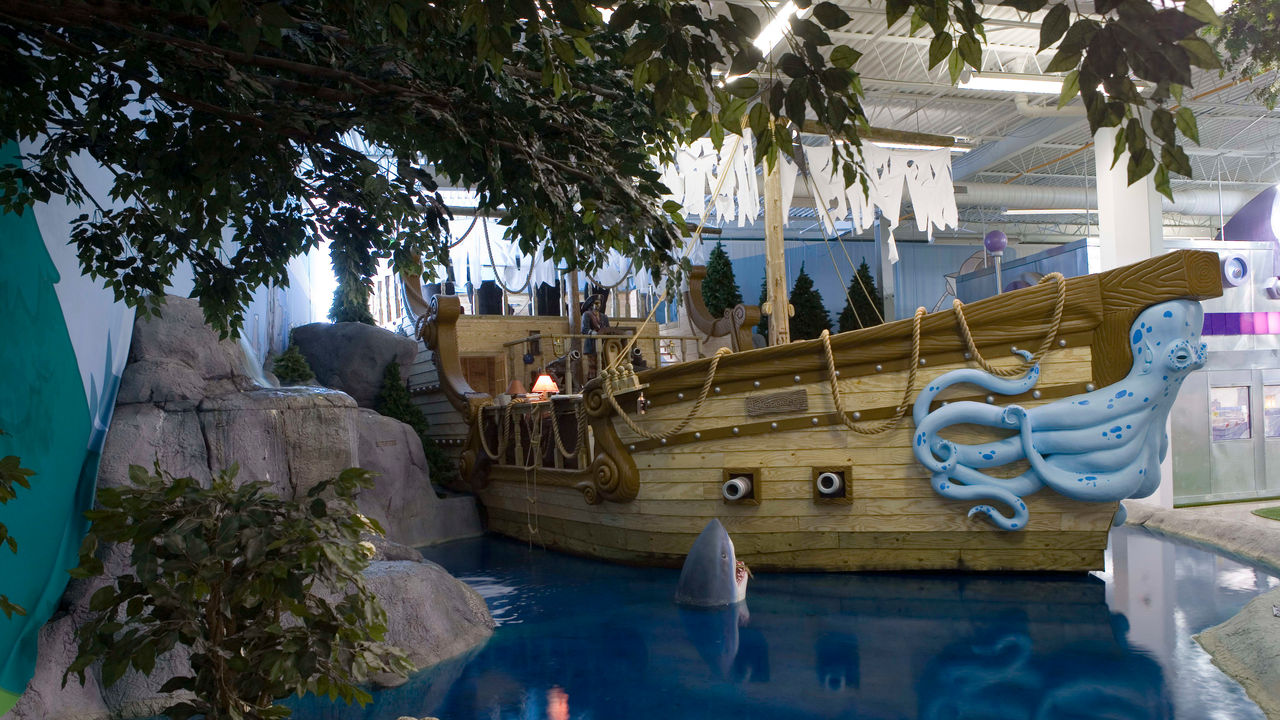 A large indoor playground with an octopus ship.