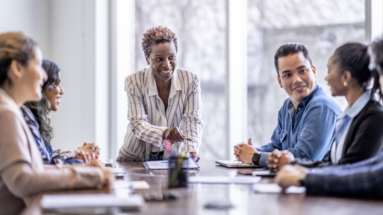A group of people sitting around a table.